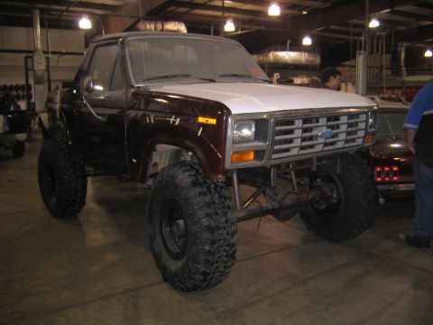 1982 Ford Bronco - This lifted Ford Bronco has a two-tone paint job and aggressive off-road tires.