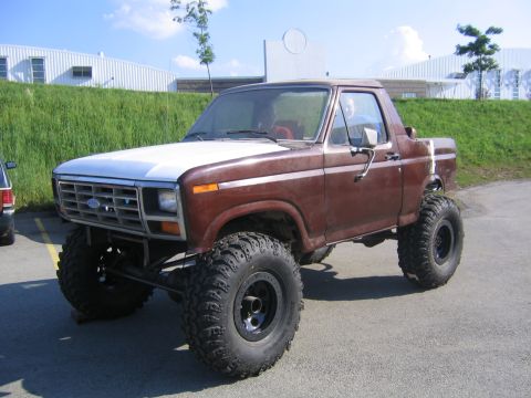 1982 Ford Bronco - This lifted 1980 Ford Bronco features a two-tone paint scheme and oversized off-road tires.