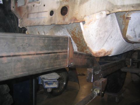 1982 Ford Bronco - Custom metalwork is being added to a vehicle's frame, with visible rust and signs of repair.