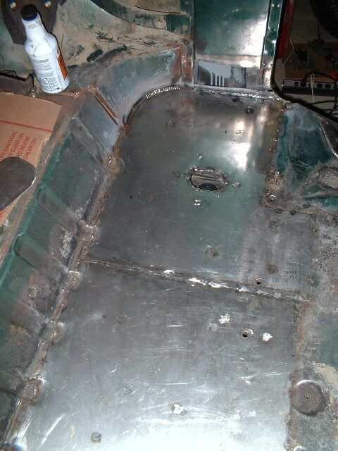 1979 Ford Bronco - Sheet metal over rusty floor.