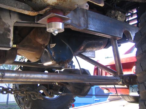 1982 Ford Bronco - Close-up of the suspension and frame components on a heavily modified off-road vehicle.
