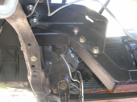 1996 Ford Bronco - This image shows a close-up view of the vehicle's undercarriage, focusing on suspension and frame components.