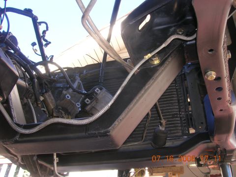 1996 Ford Bronco - Underside view of a vehicle's engine bay and chassis, showing structural elements and mechanical parts.