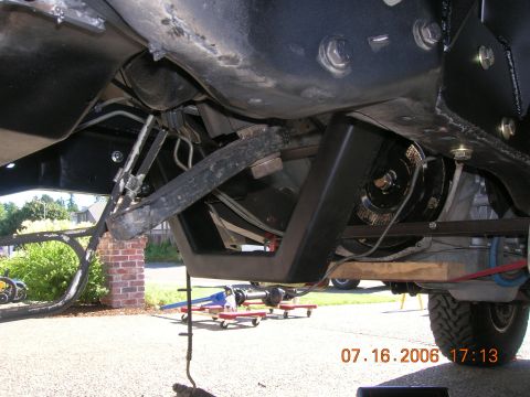 1996 Ford Bronco - A close-up view of the undercarriage reveals various mechanical parts and suspension elements.