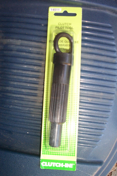 1995 Ford Taurus - A clutch pilot tool is packaged with text indicating its purpose and compatibility.