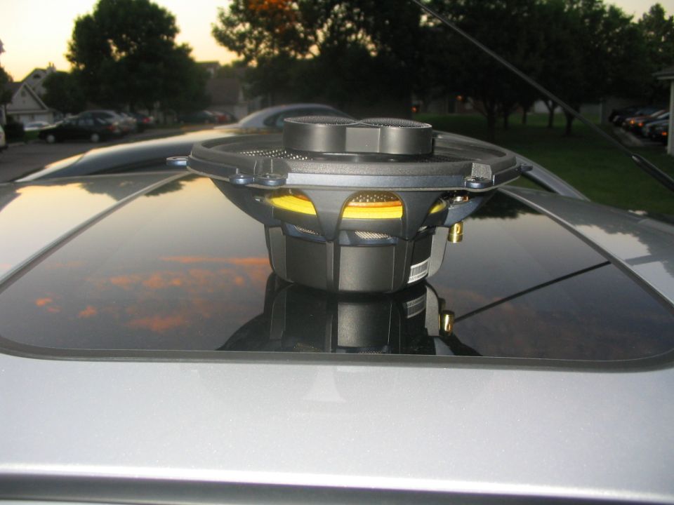 Car speaker mounted on a sunroof