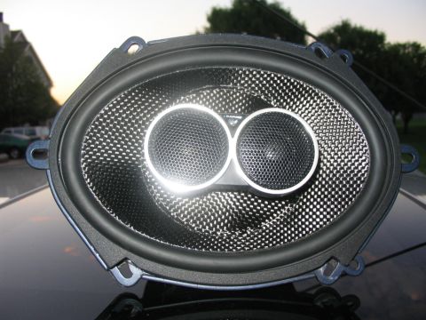 2003 Ford Focus - Aftermarket oval car speaker with dual tweeters and a carbon fiber cone.