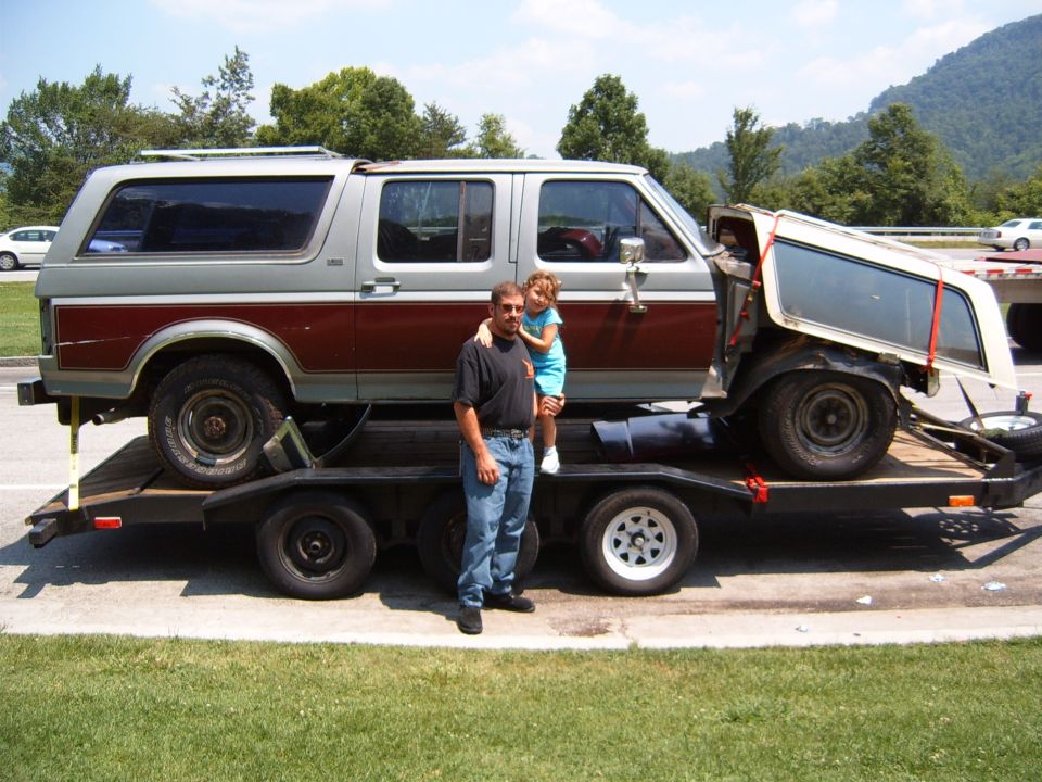 Side view of a 1993 Ford Bronco on a trailer with its top removed