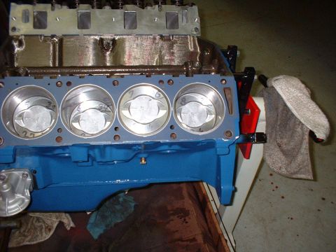 1965 Shelby Cobra - Close-up view of an engine block with pistons, showing internal engine components.