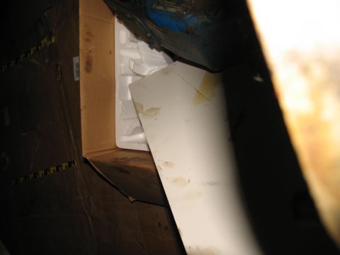 1978 Ford Bronco - Cardboard boxes and white packing material are visible, with a white panel obscuring part of the view.
