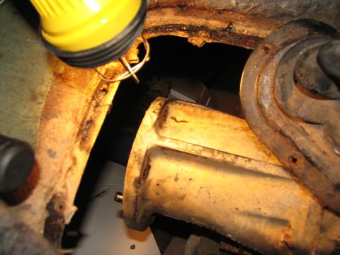 1978 Ford Bronco - This photo shows a close-up view of a vehicle's transfer case, illuminated by a work light.