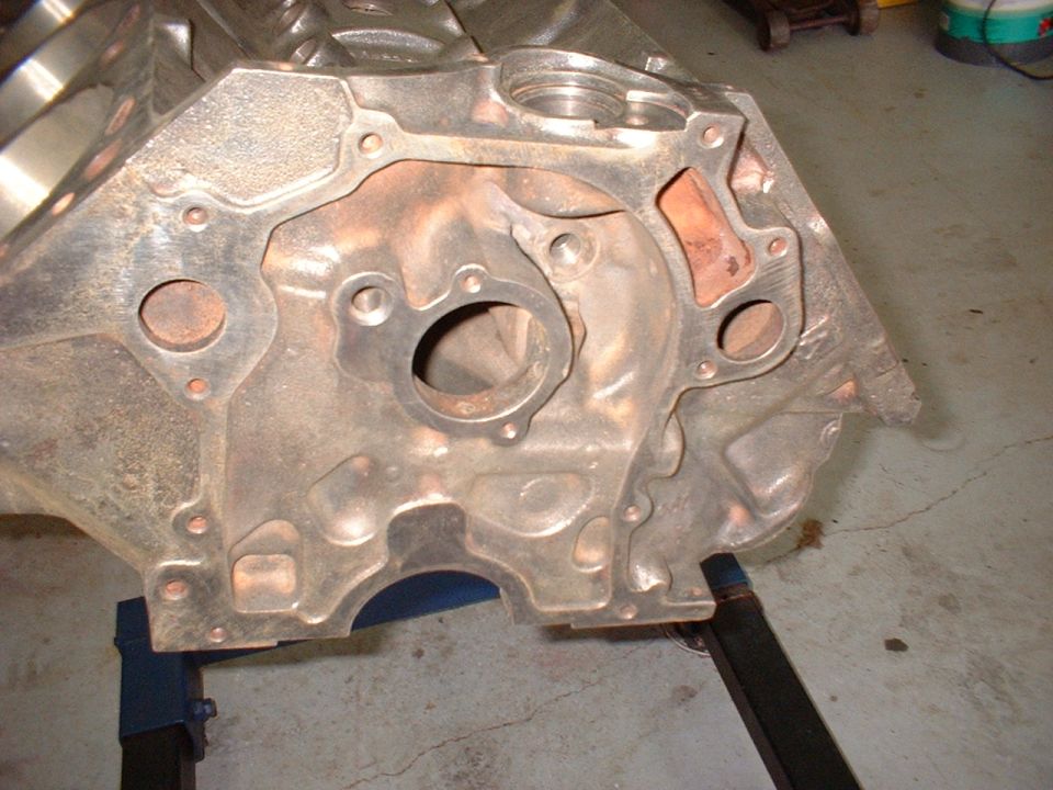 Close-up of an engine block on a stand. Shows mounting holes and internal passages