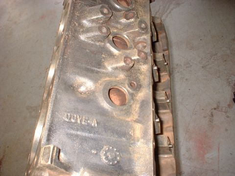 1970 Ford Torino - Close-up of an engine block showing casting marks and bolt holes.