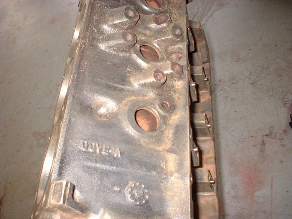 Engine block with "DOVE-A" casting mark and a circular emblem