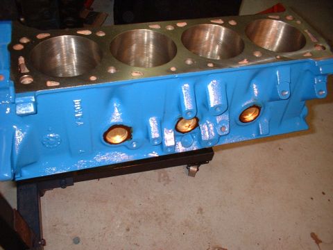1970 Ford Torino - A freshly painted engine block sits on a stand, ready for assembly.