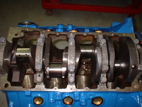1970 Ford Torino - Close-up view of an engine's crankshaft and connecting rods, with a Supermotors.net watermark.