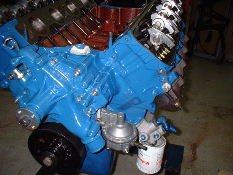 1970 Ford Torino - Close-up of a V8 engine block, painted blue, with attached fuel pump and oil filter.