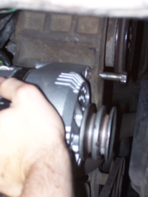 1986 Ford Bronco - This is how the alt goes in from underneath. Takes a little wiggling to get both arms in and out.