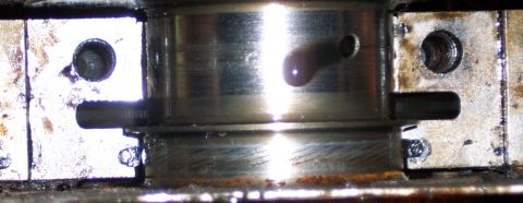 1978 Ford Bronco - This is a close-up view of an engine bearing, showing wear and oil.