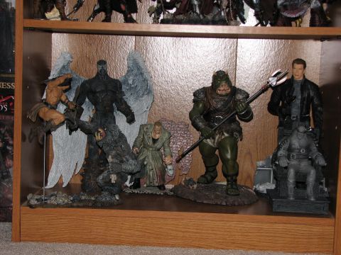 1991 Ford Bronco - Various action figures are displayed on a shelf, some with fantasy elements like wings and armor.