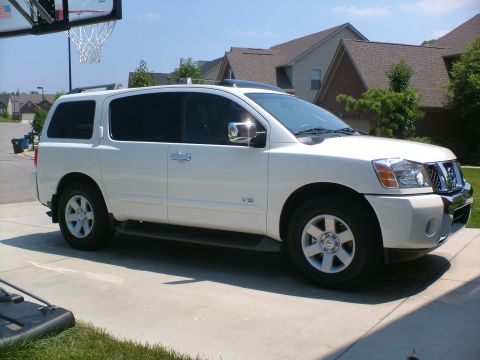 2006 Nissan Armada - This 2006 Nissan Armada is captured in a 3/4 front view, parked on a concrete driveway under a clear sky.