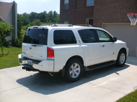 2006 Nissan Armada - Rear view of a white 2006 Nissan Armada SUV parked on a concrete driveway.