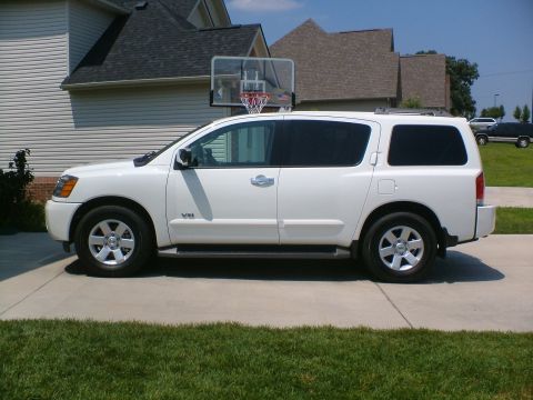 2006 Nissan Armada - Side view of a white 2006 Nissan Armada parked in a driveway.