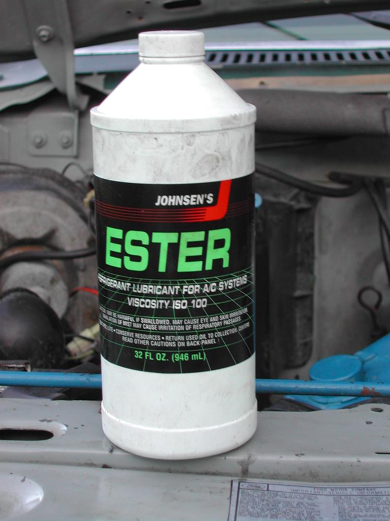 Now you can install the condensor and the evaporator coils back into the truck. You can also install the compressor (rebuilt $199.95) . Before connecting the lines you'll have to add the new ester oil ($12.00 for 32oz) into the system. My system calls for 10oz of oil. It needs to be spread around a little. I put 5oz in the suction side of the compressor, 1oz in the condensor, 1 oz in the new accumulator, and 3oz in the evaporator. Now you can connect all the hoses and fittings using new o-rings soaked in the ester oil. You can also put on the R134a conversion ports ($12.50) to the high side port above the compressor and the low side port on the accumulator. Check the instructions with the ports that you get because sometimes you remove the old valve cores and sometimes they stay.
