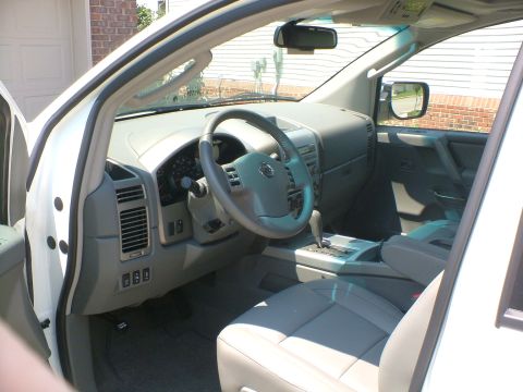 2006 Nissan Armada - Interior view of a 2006 Nissan Armada, highlighting the dashboard and seating area.
