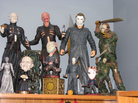 1991 Ford Bronco - A shelf displays a collection of horror movie action figures, including characters from Hellraiser and Halloween.