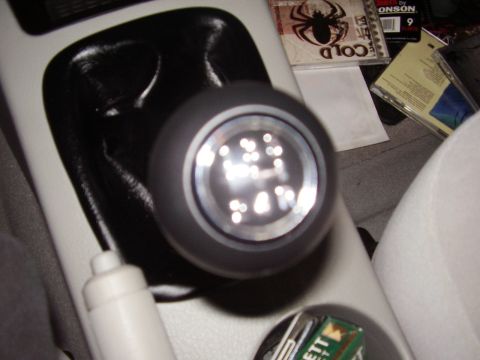 1996 Ford F-150 - Close-up of a manual transmission shift knob, showing the 5-speed gear pattern.