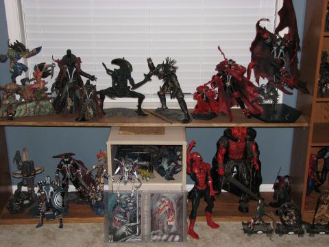 1991 Ford Bronco - A display of various action figures, including characters from Spawn and Alien franchises, arranged on shelves.
