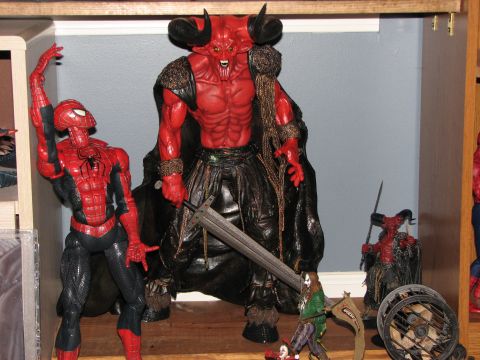 1991 Ford Bronco - Action figures including Spider-Man and a demon are displayed on a shelf.