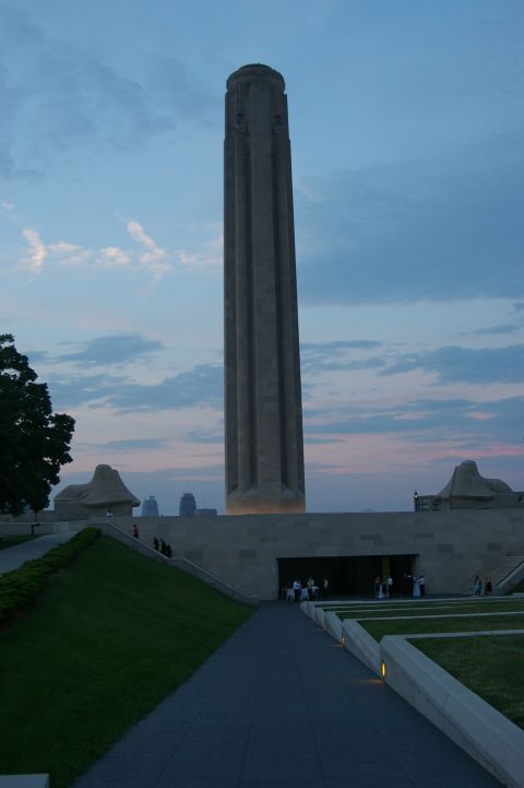1998 Jeep TJ - A tall, fluted tower stands against a twilight sky, with architectural elements and landscaping in the foreground.