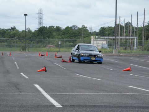 2001 Mercury Grand Marquis - BMW 7 Series navigates a cone course in an open lot.