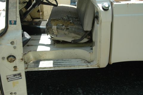 1963 Ford F-250 - Interior view of a 1963 Ford F-250, highlighting the driver's seat and door jamb area.