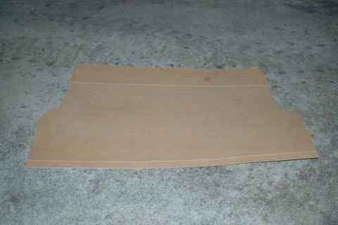 1993 Ford Mustang - A cardboard template, possibly for a car part, rests on a textured concrete surface.