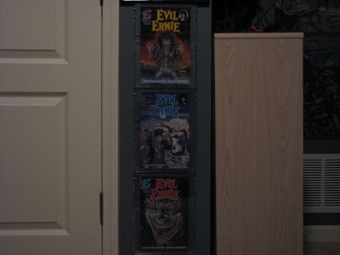 1991 Ford Bronco - Collection of Evil Ernie comic books displayed on a wall.