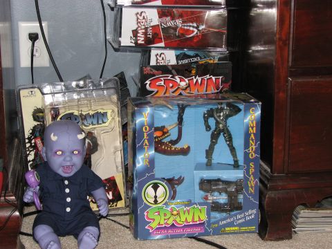 1991 Ford Bronco - A collection of Spawn toys and a doll are displayed on a shelf and the floor.