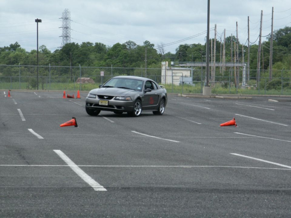 Gray coupe on track with cones. 2001 Ford Mustang