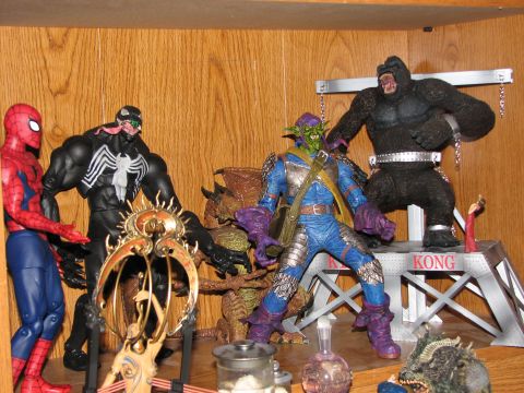 1991 Ford Bronco - Collection of Marvel and King Kong action figures displayed on a shelf.
