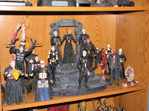 1991 Ford Bronco - A shelf displays a collection of Hellraiser action figures, including Pinhead and other cenobites.