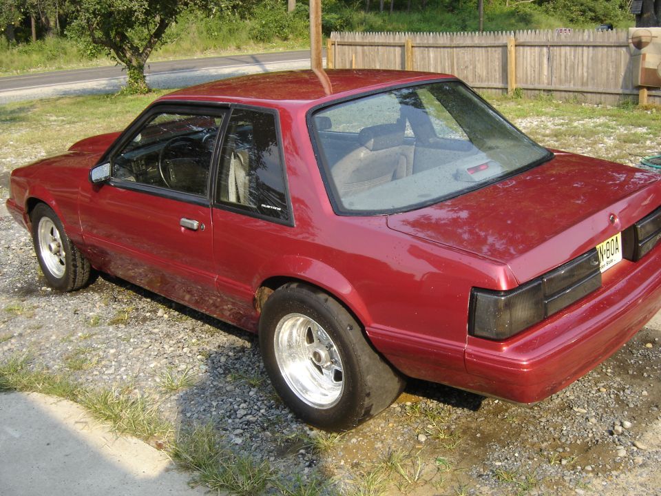 Red Fox-body Mustang notchback, 3/4 rear, on polished drag wheels with wide rear tires