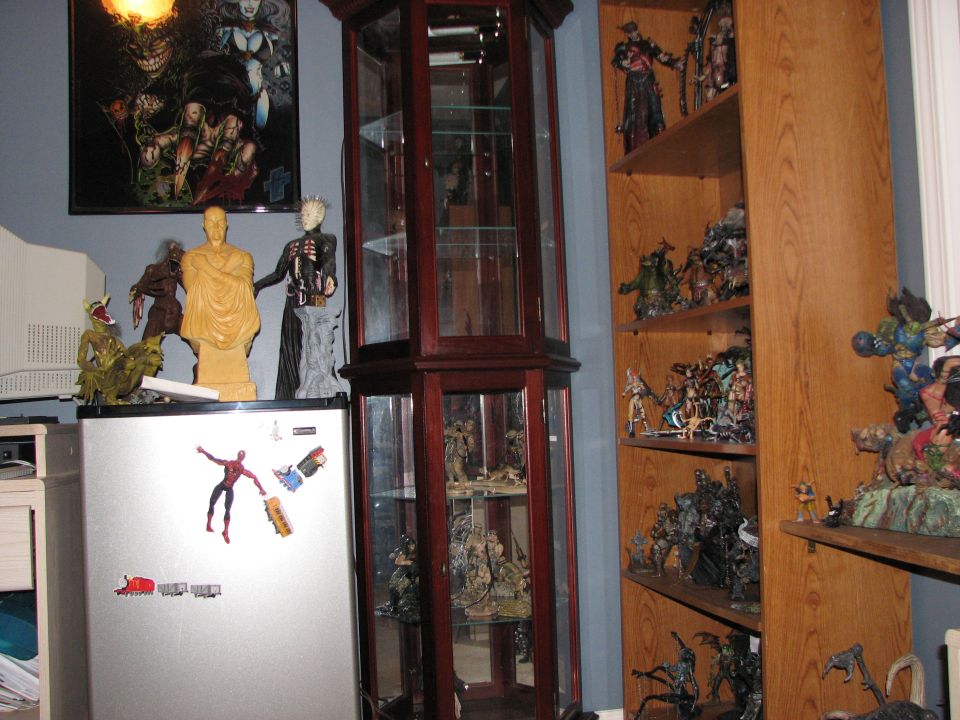 Action figures and memorabilia displayed on shelves and a refrigerator
