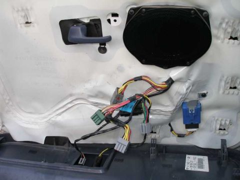 2001 Ford Crown Victoria - Note the blue box, which is the auto down window unit. Also note the two wires in the lower portion of the picture that run to the fuel doo…