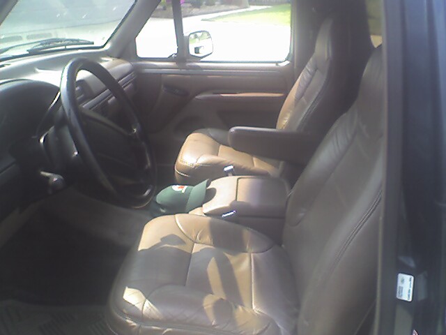 1995 Ford Bronco interior showing leather seats, dashboard, and steering wheel
