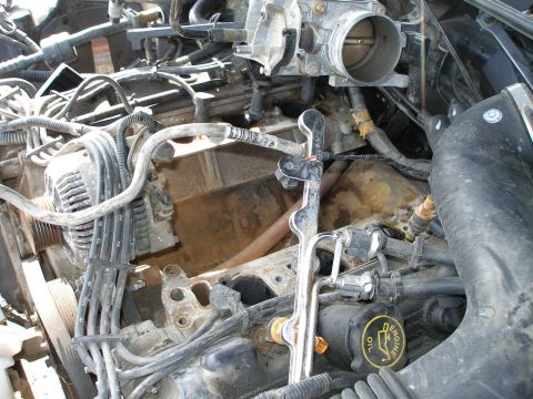 1998 Ford Crown Victoria - The intake has been removed as has the radiator. However, the injectors, fuel rails, one coil pack, airbox, MAF, throttle body, plenum, fus…