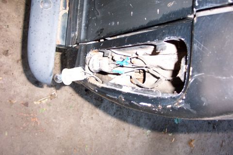 1978 Ford Bronco - The exposed wiring and socket of a vehicle's tail light assembly are visible.