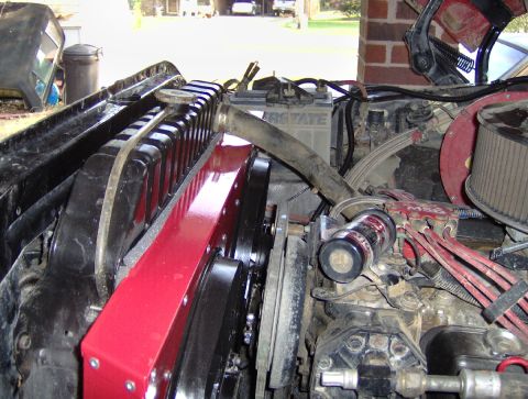 1978 Ford Bronco - Close-up view of an engine bay, highlighting a radiator with dual fans and associated engine parts.