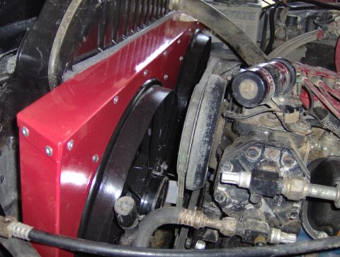 1978 Ford Bronco - Engine bay detail with a custom red fan shroud installed.